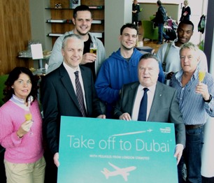Jonathan Crick, Commercial Director Stansted Airport (centre left) and Peter Mantle, Head of UK Sales and Operations for Pegasus Airlines (centre right) in the No.1 Traveller lounge at Stansted with some of the first passengers checked in for the new Dubai connection 