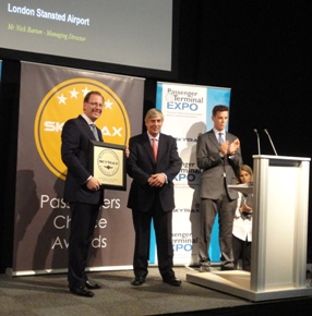 Nick Barton (left), Stansted’s Managing Director, receiving the award from Edward Plaisted (middle), Chairman of SKYTRAX